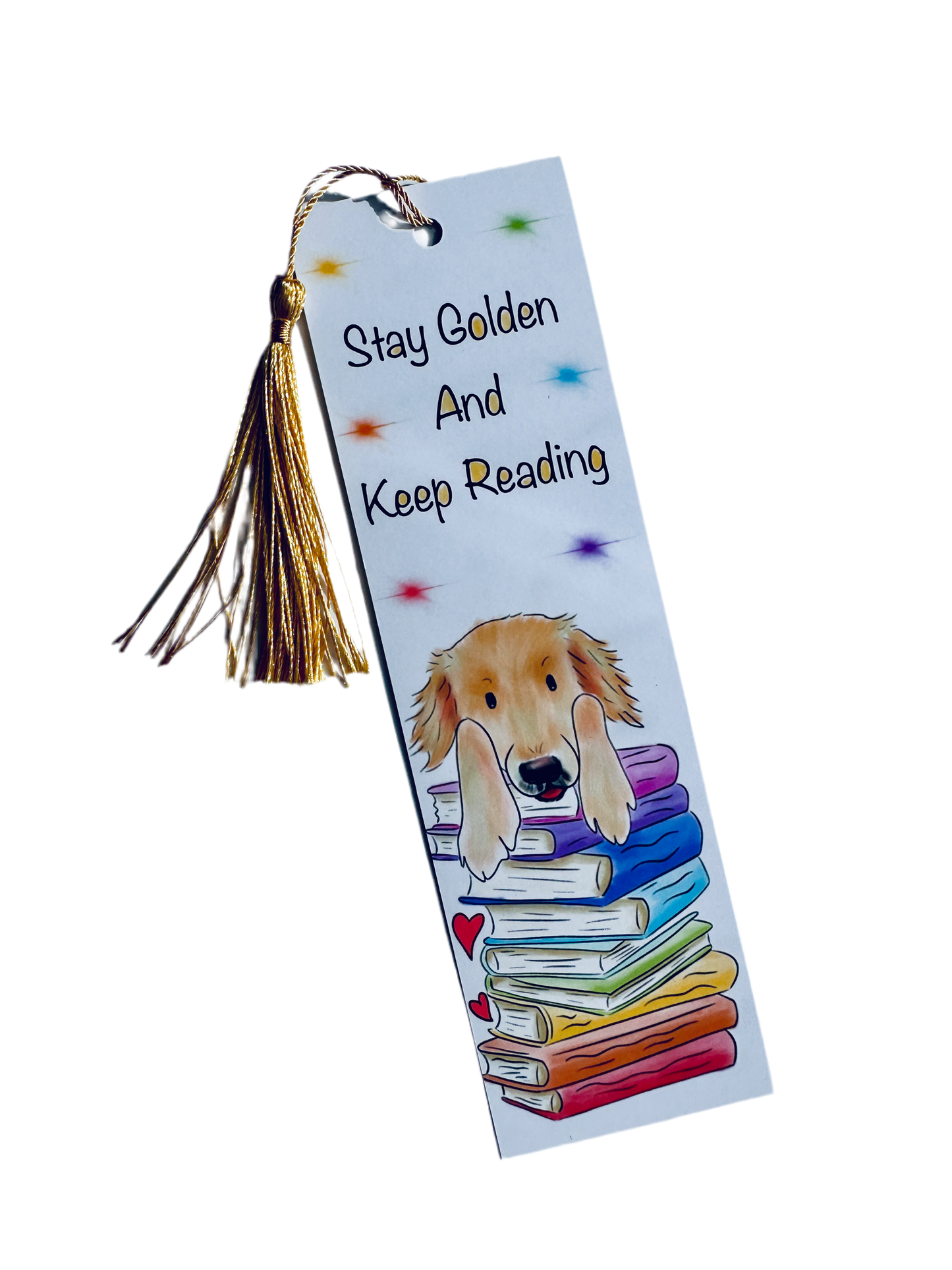 Bookmark with an illustration of a stack of rainbow books with a golden retriever leaning on top, text saying Stay Golden And Keep Reading, rainbow stars on the background. The image has a plain white background. 