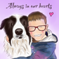 Illustration of a border collie dog and a child smiling wearing glasses and a blue top, hugging together. Background is purple and text says Always in our hearts. 